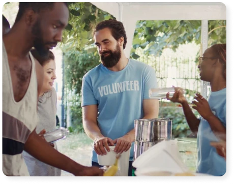 a group of volunteers setting up a picnic