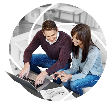 a couple reviewing their finances on a phone and a laptop