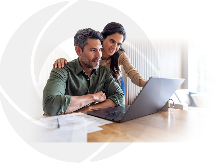 a couple viewing their finances on a laptop