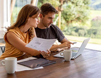 a couple looking at their finances