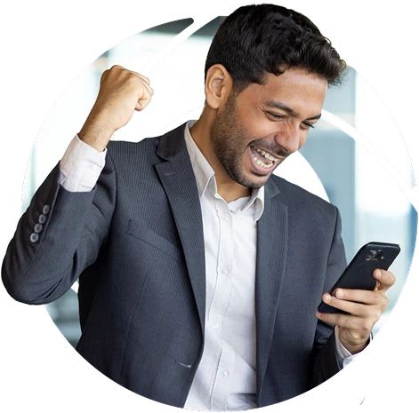 a man looking at his phone doing a fistbump