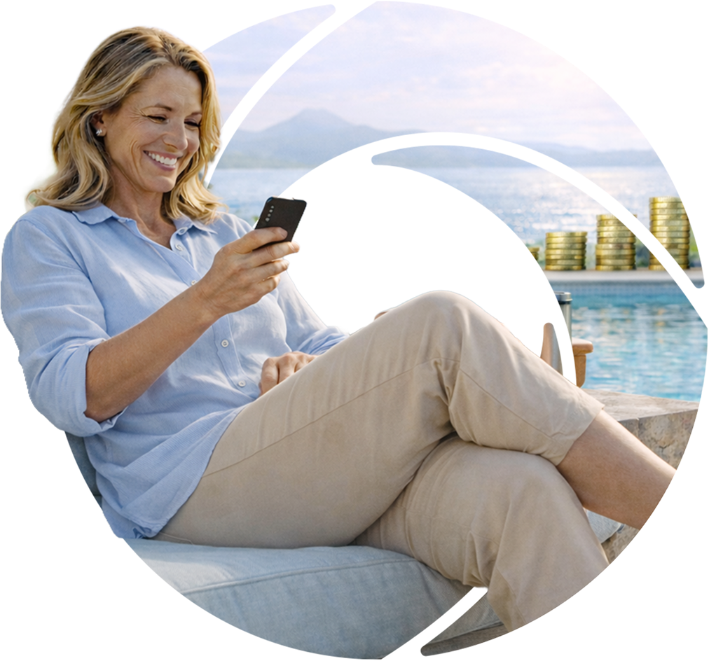 a lady sitting in a lounge chair looking at her cell phone