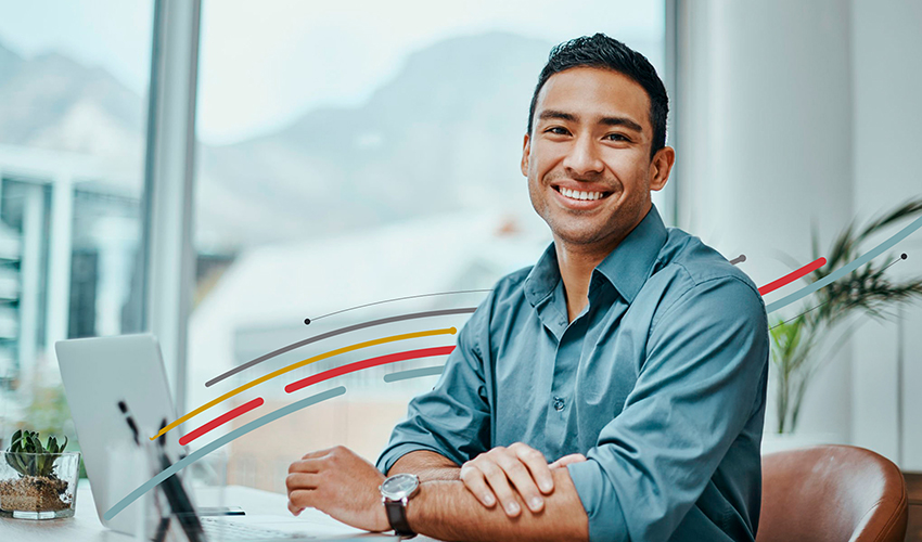 a man on the computer and smiling